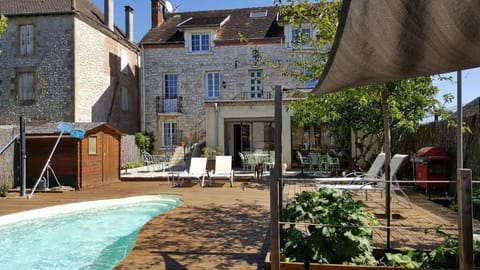 Seasonal outdoor pool, open 9:00 AM to 10:00 PM, pool umbrellas