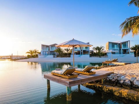 Linger over golden-hour lagoon views from cushioned loungers.