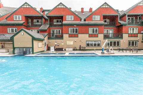 Soak up the mountain air and take a dip in the inviting outdoor pool, a perfect retreat in any season.