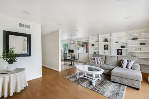 Comfortable living room with cozy couch seating and Smart TV