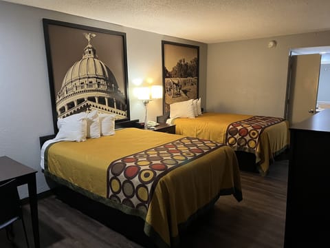 Desk, blackout drapes, iron/ironing board, free cribs/infant beds