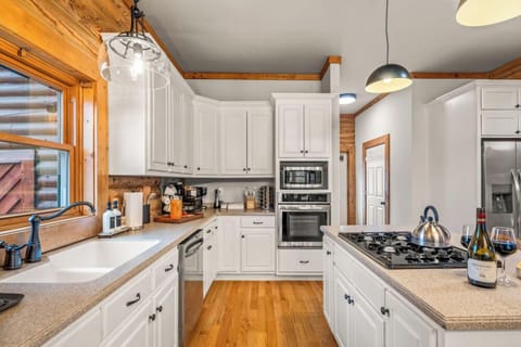 Cook comfortably with ample counter space, plenty of cabinets, and essential kitchen items—ideal for prepping meals, serving drinks, or hosting a group dinner.