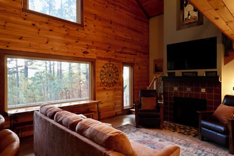 Fireplace with wooded scenery views