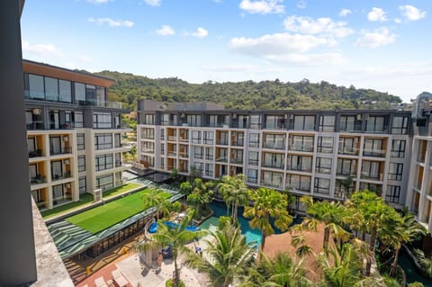 Wide-angle view of the property showcasing modern building design and landscaped outdoor areas.