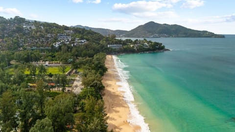 Stunning aerial view of the coastline with beach and turquoise waters.