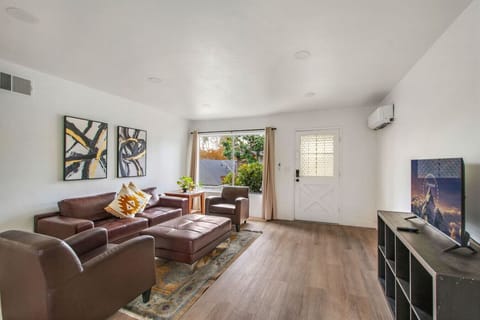 Cozy living room with comfortable seating and a Smart TV for your entertainment.