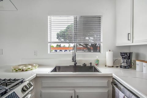 Clean and functional kitchen sink area.