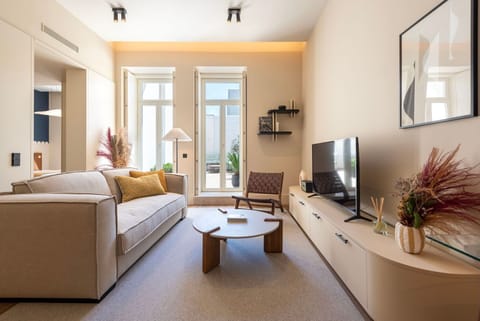 Stylishly decorated living area featuring a plush sofa and flat-screen TV — the perfect space to unwind after exploring Porto.

#CozyVibes #DesignInteriors #PortoApartment #ComfortAndStyle