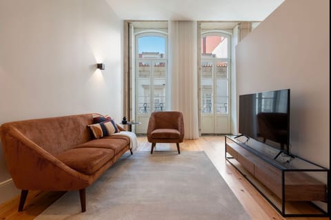 A bright living area filled with natural light, framed by expansive windows overlooking iconic Flores Street.

#NaturalLight #CityViews #ElegantLiving #UrbanCharm