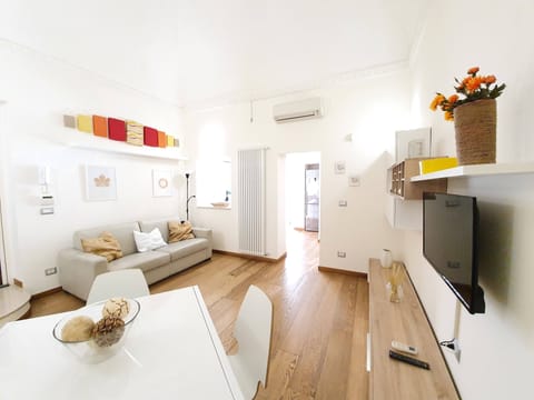Apartment, Garden View | Living area | Flat-screen TV