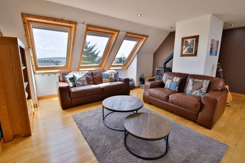 First floor living space, wood burner, stunning views