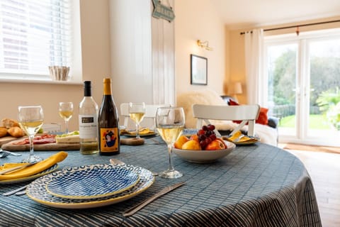Enjoy meals at the dining table looking beyond to the garden