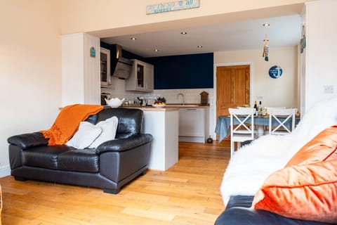 Open-plan living and dining area with a well-equipped kitchen