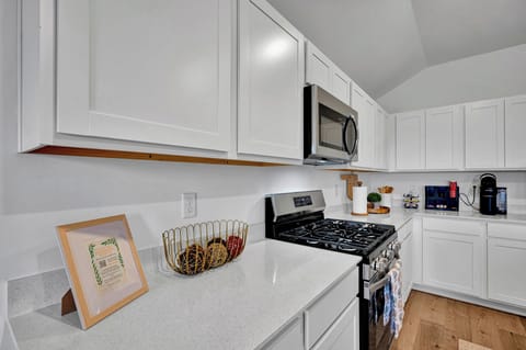 Kitchen counter and gas stove with stainless steel appliances