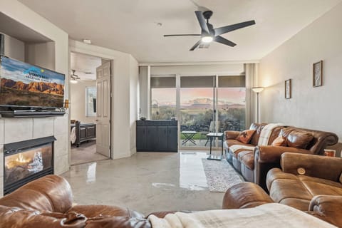 Cozy up by the fireplace and enjoy stunning desert views right from the living room.