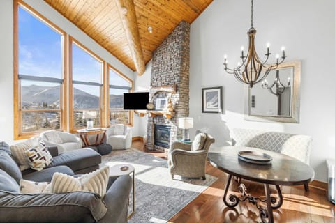 【Great Room】Vaulted ceilings and a wall of glass framing Mt. Crested Butte from the sofa