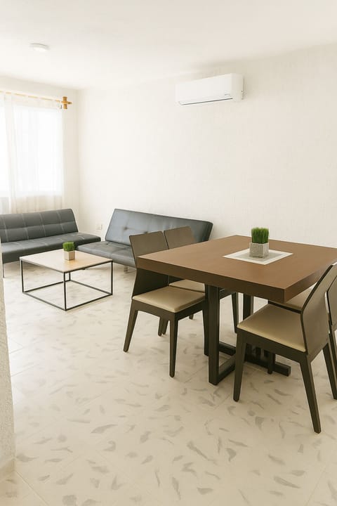 Bright living area with natural light and comfortable seating.