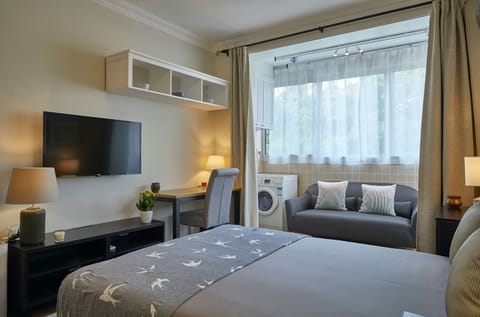 Superior Studio, Courtyard View | Living area | 42-inch LCD TV with cable channels