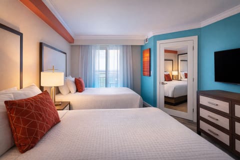 Settle in comfortably with two beds and calming coastal tones.