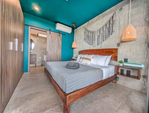 Unwind in a stylish bedroom sanctuary where contemporary comfort, artisan details, and warm natural textures create an inviting space to recharge after a day of exploring.