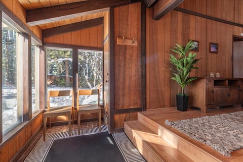 Step into the large entryway, lined with floor to ceiling windows and unload your winter gear.