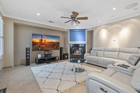 Cozy movie nights await! Enjoy a spacious living room with plush sectional seating, a large smart TV, surround sound, and a warm fireplace—the perfect spot to relax after a day of adventure.