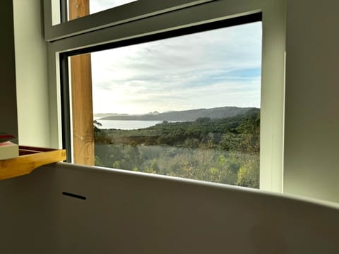 Soak in the tub with direct views of the sea and forest.