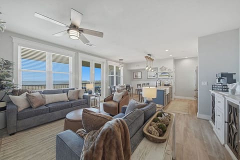 Open floor plan with a wall of windows looking out towards the water!