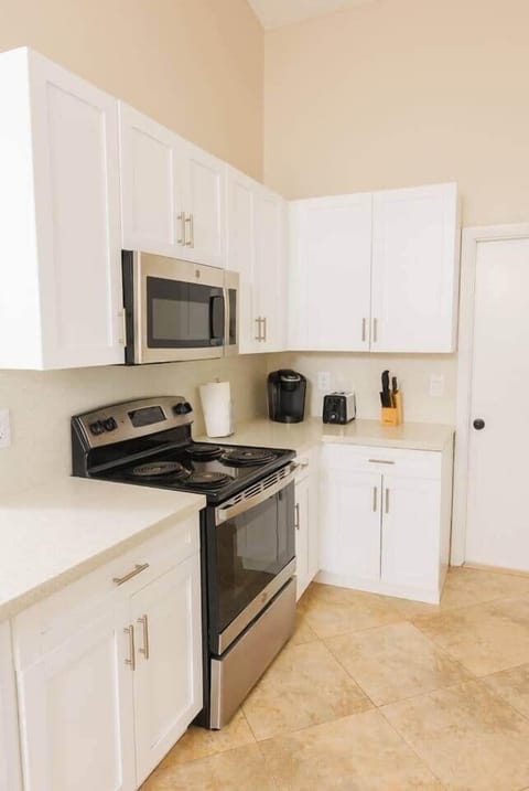 Our kitchen is filled with natural light and comes fully equipped with everything you need. Enjoy the convenience of a dishwasher, a full set of silverware, plates, and cups, as well as a coffee machine to start your mornings right.