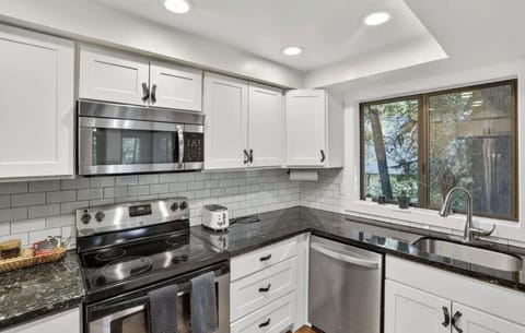 Kitchen is stocked with coffee, tea, avocado oil, spices and quality cookware