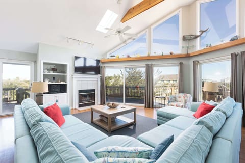 Top Level: Spacious Living Room w/ Vaulted Ceilings, Floor-to-Ceiling Windows, Smart TV, and Plush Sectional Seating
