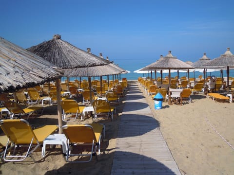 On the beach, sun loungers, beach umbrellas, beach towels