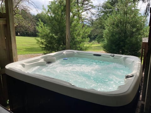 Soak in the hot tub surrounded by nature and enjoy peaceful, relaxing moments.