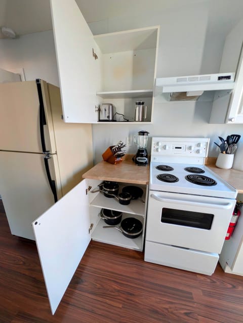 Kitchen with Cabinets open | Serviced Apartment