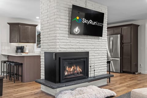 Living room has smart TV and gas fireplace