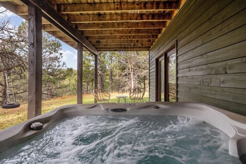 Immerse yourself in nature from your private, bubbling hot tub located on the covered patio. Perfect for stargazing or relaxing after a day of hiking
