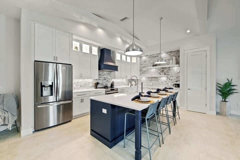 House A - Kitchen - Oversized Refrigerator -  Dishwasher - Oven - Large Gas Stove - Bar Seating for 4