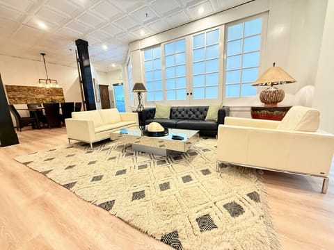Expansive Living Room With Doors Leading to Dining Area