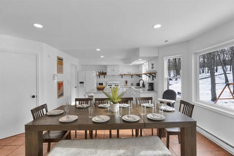 Enjoy home-cooked meals and good company at the spacious dining table.