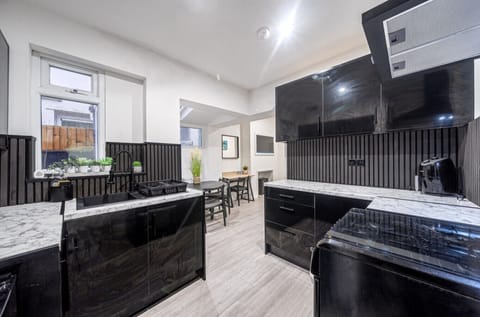 Contemporary kitchen with full-size oven and hob