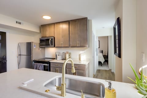 Modern kitchen design effects, gold tone fixtures, soft close cabinets & drawers