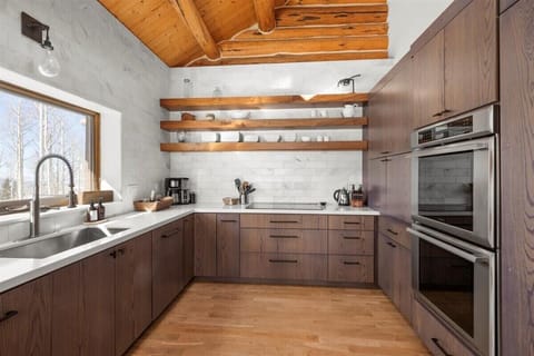 Kitchen: Drip coffee maker, toaster oven, kettle, cooking utensils, tableware