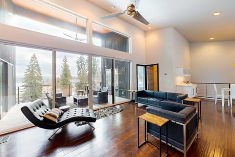 Enjoy the open concept of the kitchen, dining and living room that effortlessly lead out to the deck overlooking the Spokane River. 