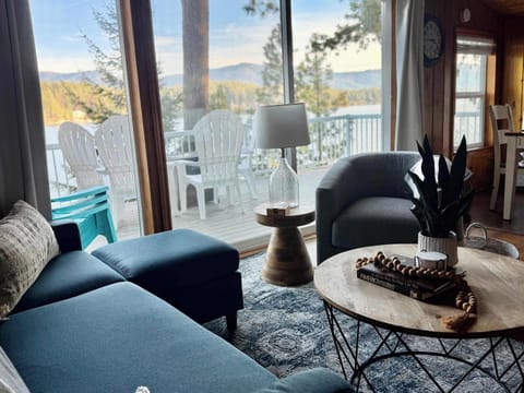 Enjoy relaxing on the couch while taking in the breathtaking views of Hayden Lake. 