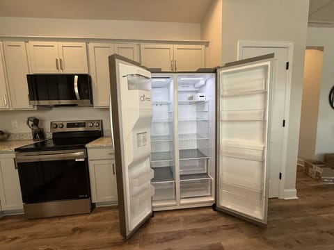 Sleek side-by-side fridge with generous space for your travel treats.