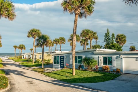 Wake up to ocean breezes at these charming, palm-lined cottages just moments from the beach. A picturesque setting for a relaxing beach stay, with lush lawns, coastal views, and easy access to sun and sand.