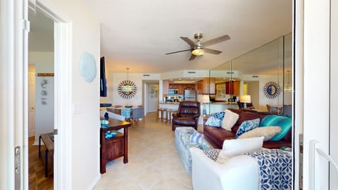 Step into this airy beach-themed condo featuring comfy seating, stylish décor, and an open layout—perfect for relaxing after a day on the sand and surf.
