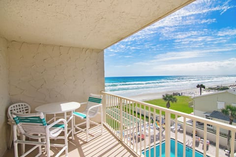 Relax on your private oceanfront balcony overlooking pristine sandy shores and rolling waves. Enjoy the ultimate beach stay with coastal breezes, sunrise views, and easy access to the beach and pool for a perfect seaside getaway.