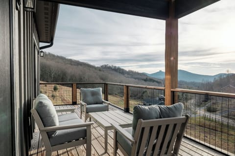 Comfortable outdoor seating with peaceful mountain views. Ideal for morning coffee, outdoor meals, or sunset lounging.