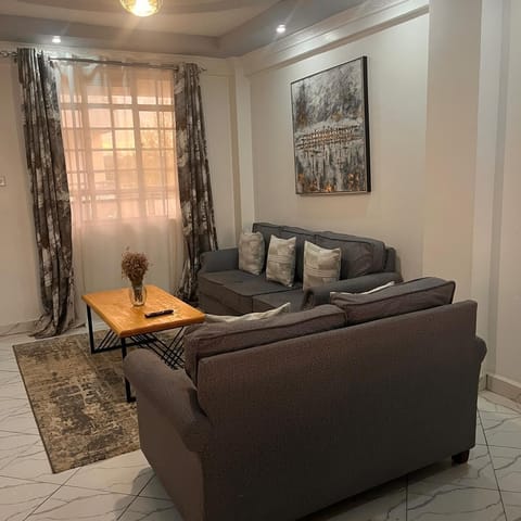 Deluxe Apartment, Garden View | Living area | 32-inch Smart TV with digital channels